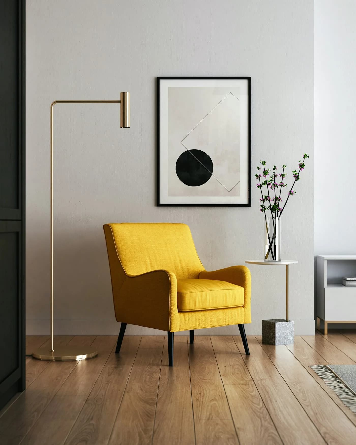 A yellow lounge chair and arc floor lamp in a calm, sunlit room
